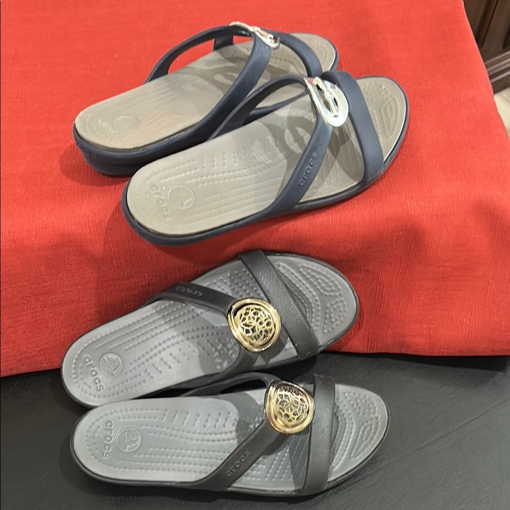Crocs Navy and Black Sandals with Gold and silver Accents. Size 6